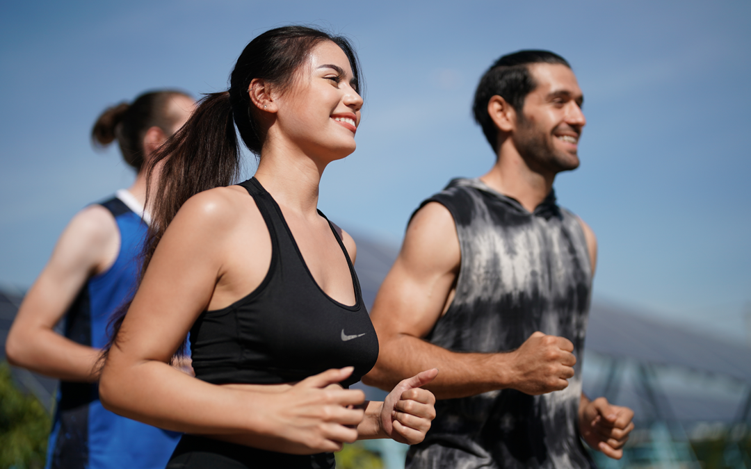 Group of 3 people jogging outside