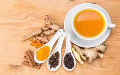 Healthy turmeric tea with black pepper, cinnamon, cloves and ginger