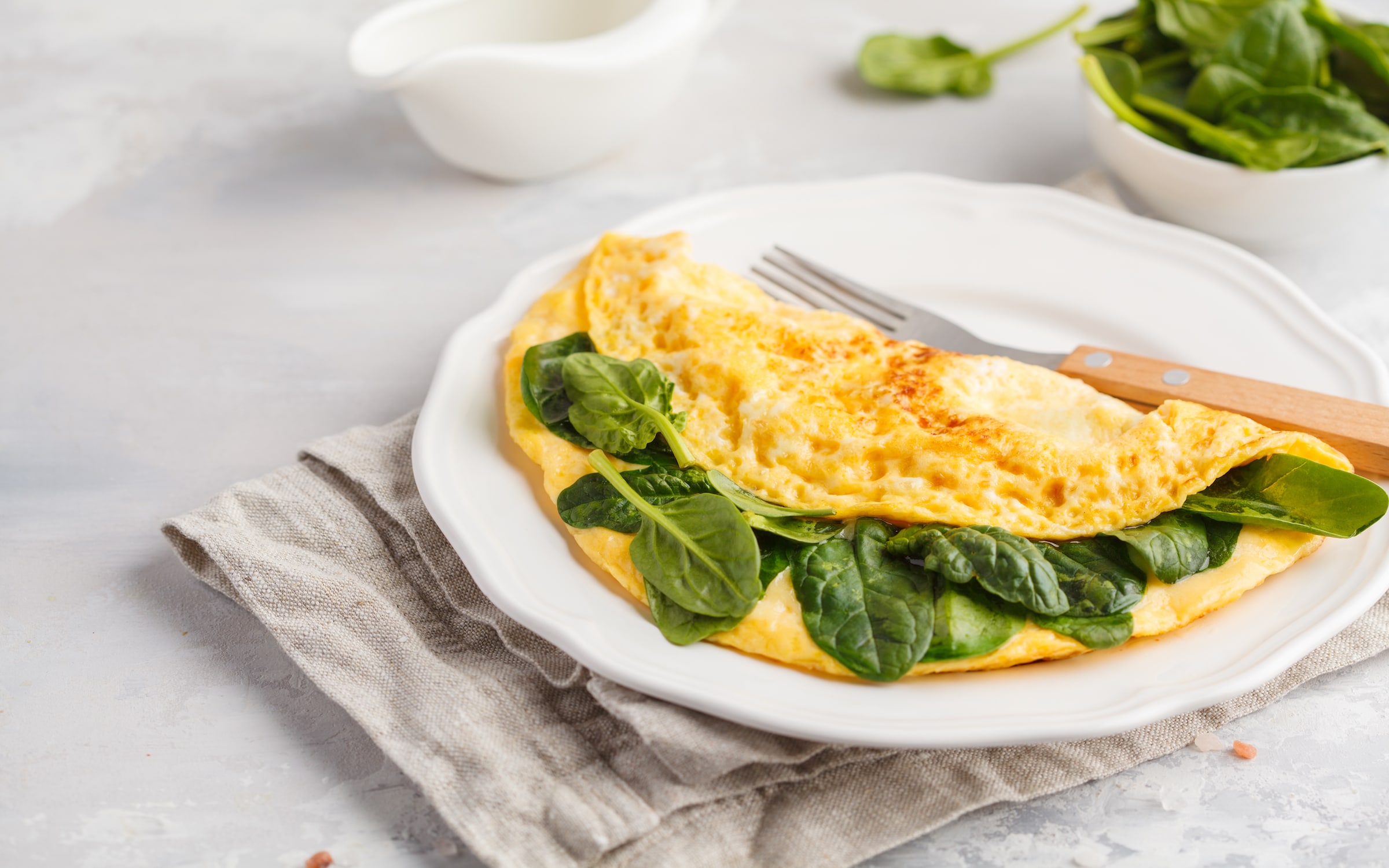 Omelette stuffed with spinach and cheese